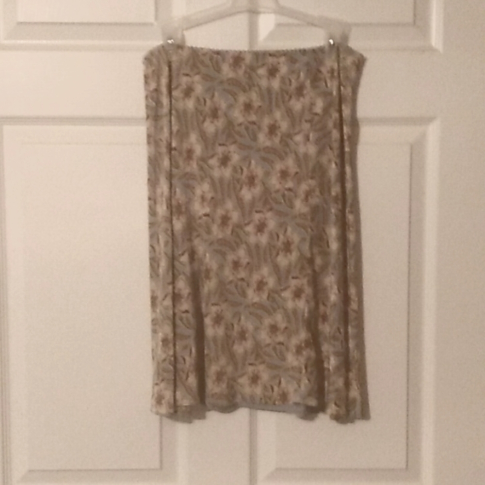 Skirt floral print. Teal red pink tan colors. Size 6.